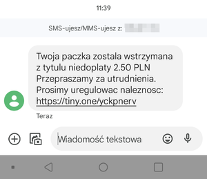 sms z treścią o konieczności dopłaty do przesyłki oraz podkreślony  link